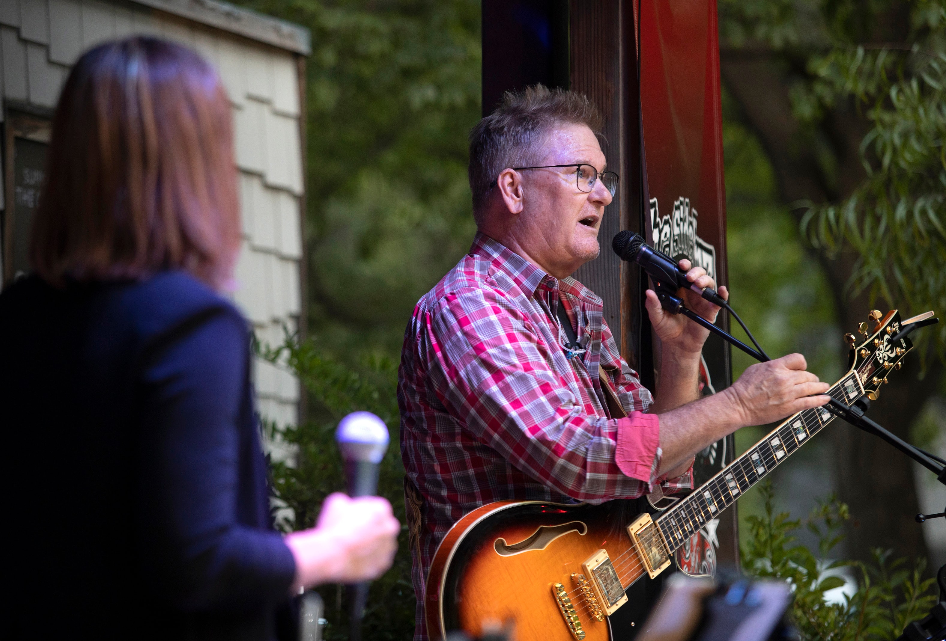 SideKarz guitarist singing at outdoor show